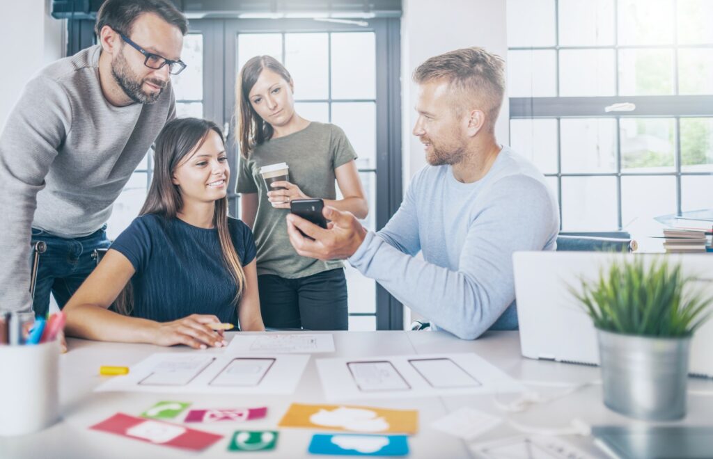 Designers drawing website ux app development.