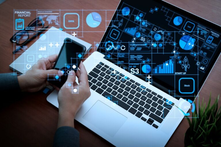 Top view of businessman hand using on smart phone and laptop com